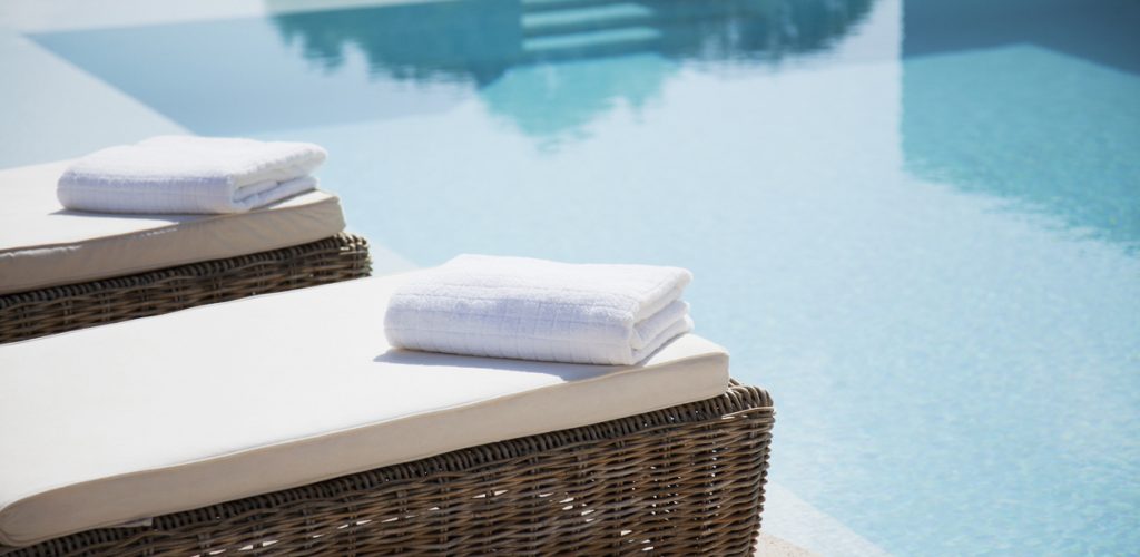 Towels laid out by the pool – Versailles Spa Hotel